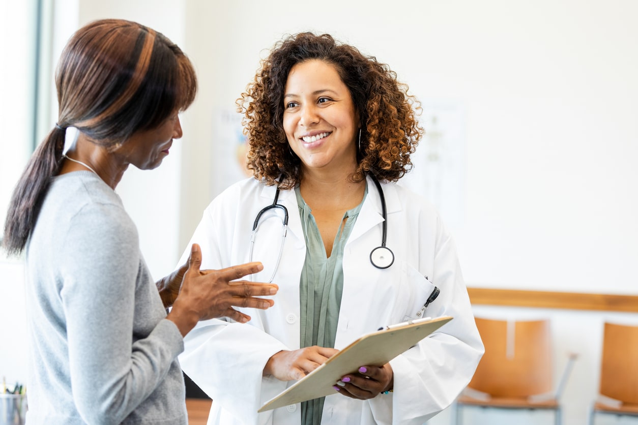 Doctor and Patient Discussing Healthcare in Clinic 
